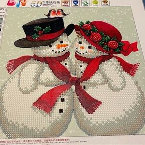 Diamond dot art finished snowmen couple.